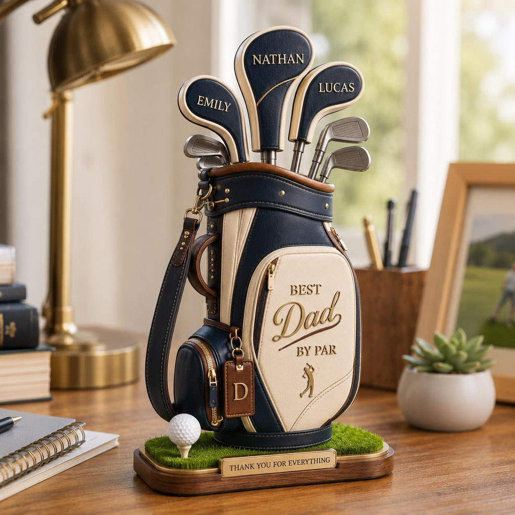 May include: A decorative golf bag with golf clubs, featuring the text "Best Dad by Par." The bag is navy blue and cream-colored, with personalized club covers. A golf ball sits on a patch of green turf, with a plaque that reads "Thank You for Everything."