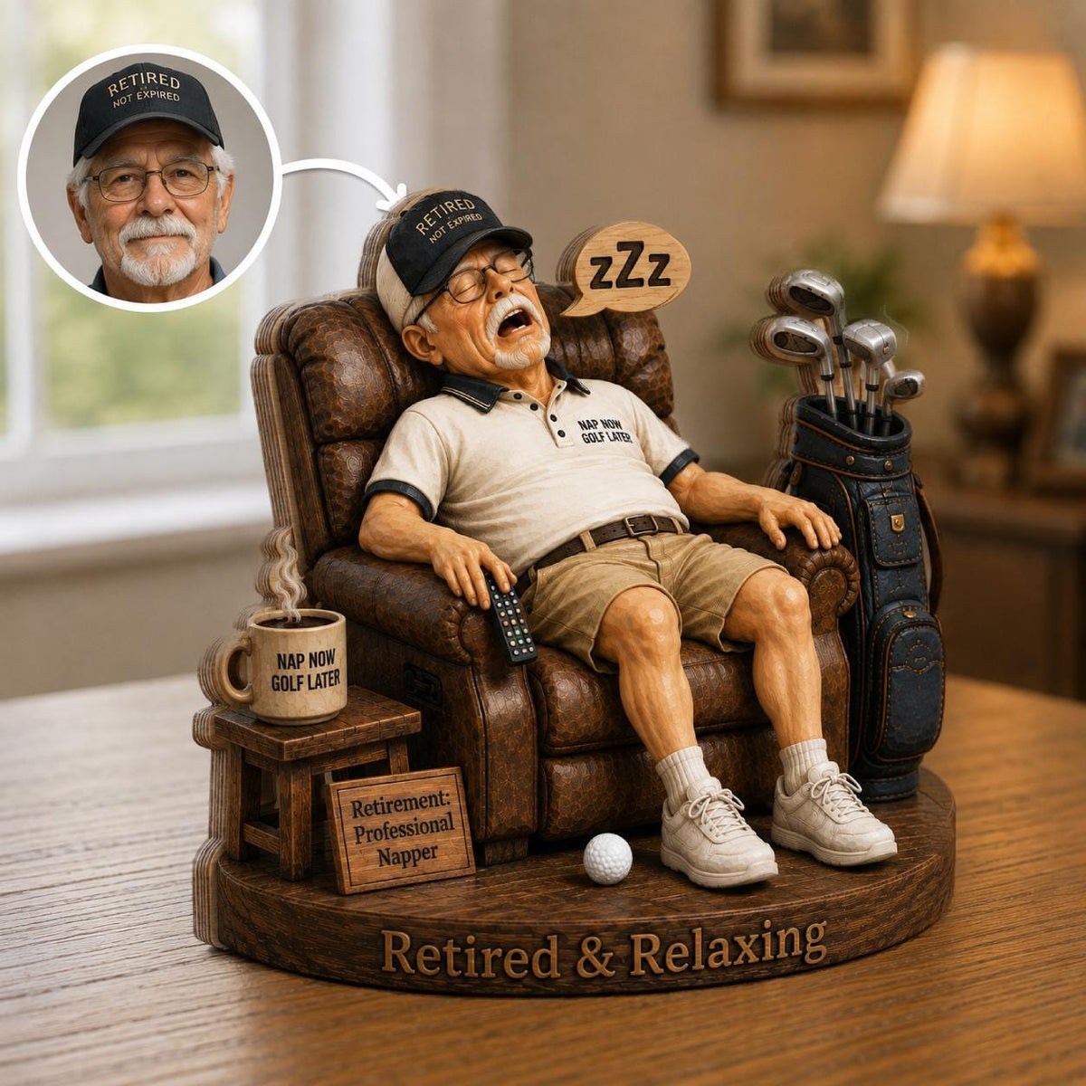 May include: A figurine of a person sleeping in a brown leather recliner, wearing a beige polo shirt with the text 'NAP NOW GOLF LATER' and a black cap reading 'RETIRED NOT EXPIRED'. A golf bag, a mug, and a sign reading 'Retirement: Professional Napper' are included.