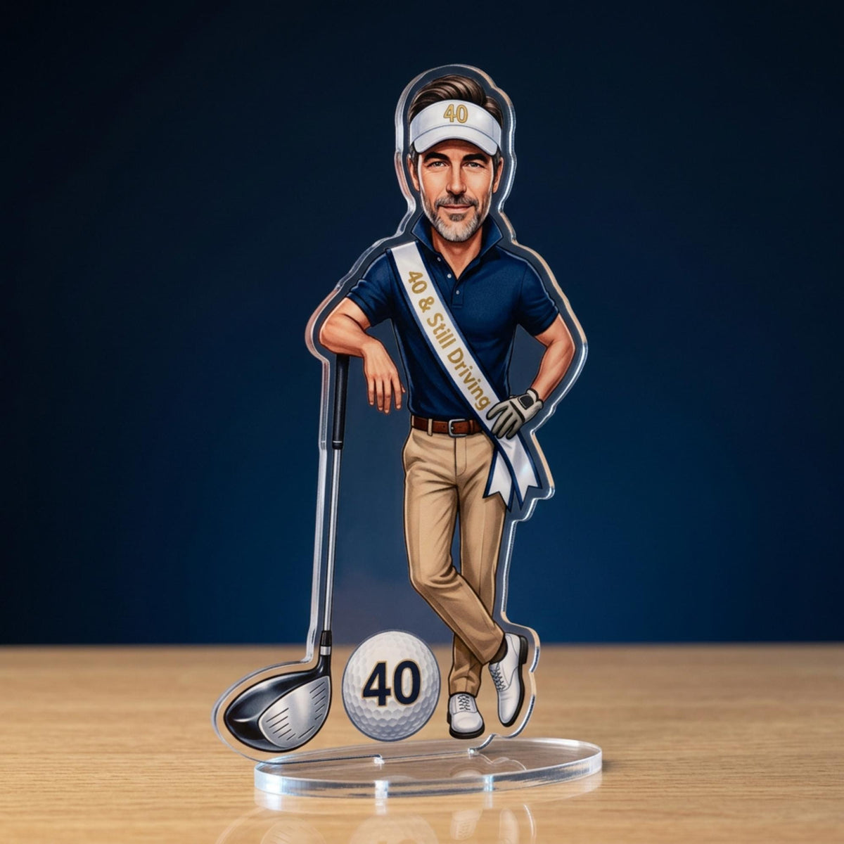 Close-up of illustration detail — polo shirt, visor with "40," sash text "40 & Still Driving," driver, golf ball — shows illustration quality and personalised elements