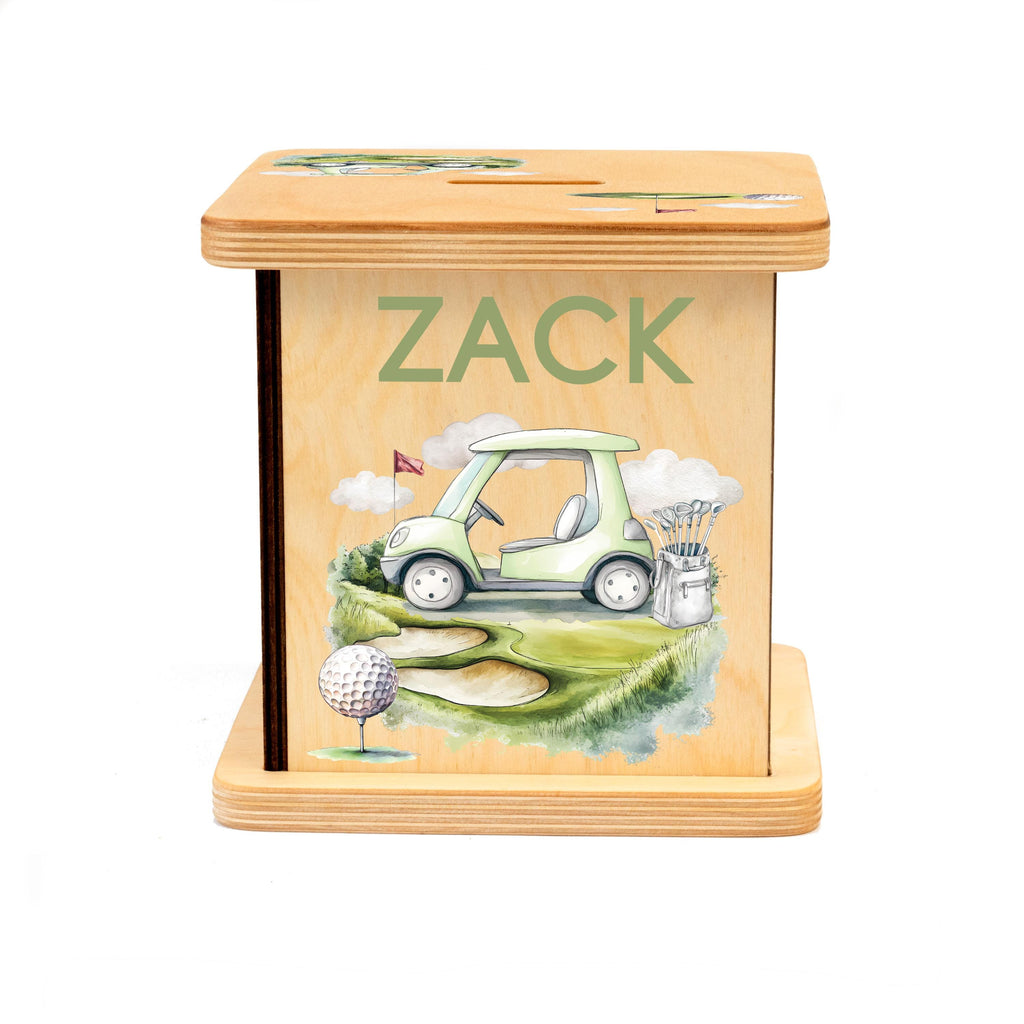 A wooden box with a golf-themed design, featuring a golf cart, golf clubs, and a golf ball.