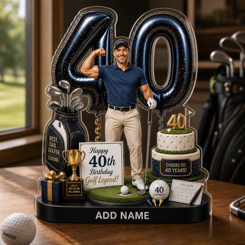 May include: A decorative acrylic display featuring a golfer flexing, large number 40 balloons, a golf bag, a two-tier cake, a gold trophy, a gift box, and a sign reading Happy 40th Birthday Golf Legend. The base includes the text ADD NAME.