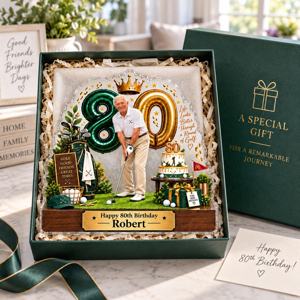 May include: A personalized 80th birthday gift set featuring a clear acrylic plaque with a golfer illustration, the text Happy 80th Birthday Robert, a green golf bag, a tiered cake, and a gift box with the text A SPECIAL GIFT FOR A REMARKABLE JOURNEY.