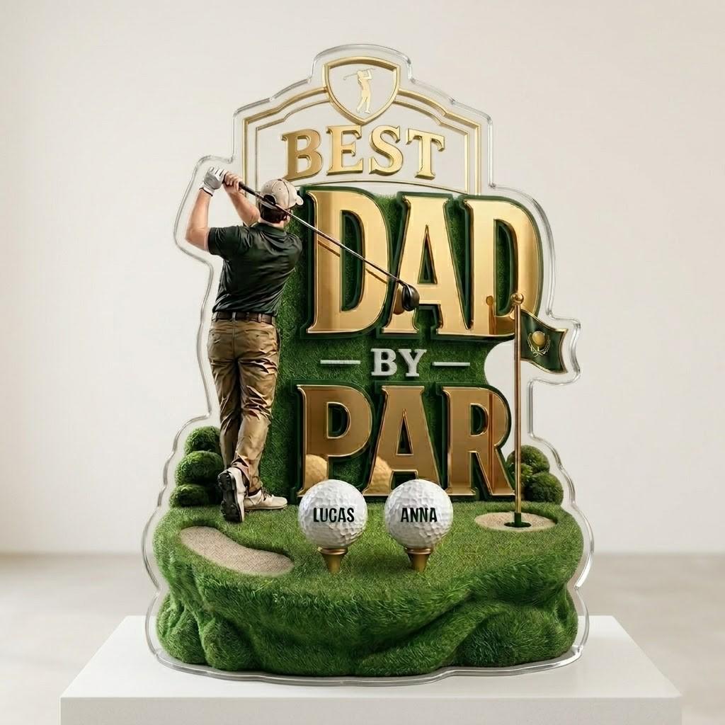 May include: A golf-themed acrylic plaque with the words "BEST DAD by PAR" in gold lettering. The design features a golfer, golf balls with names, and a green golf course. The plaque is a personalized gift.