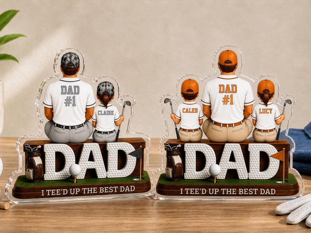 May include: Two personalized acrylic golf-themed desk ornaments featuring figures of a parent and children sitting on a base with the word DAD, a golf bag, a golf ball, and a flag. The base text reads I TEE'D UP THE BEST DAD.