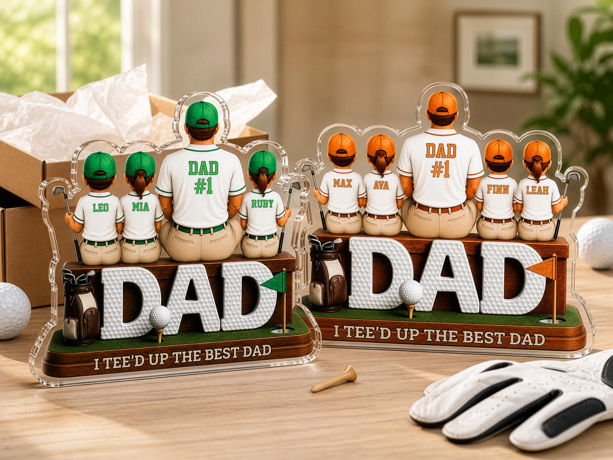 May include: Two personalized acrylic golf-themed desk ornaments featuring a central figure labeled DAD #1, surrounded by smaller figures with names like Leo, Mia, Ruby, Max, Ava, Finn, and Leah. The base displays the text I TEE'D UP THE BEST DAD.