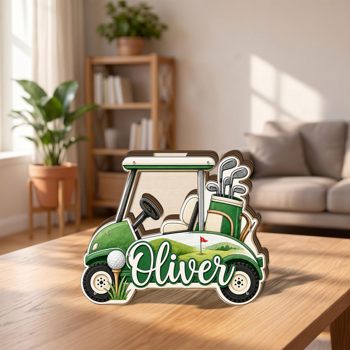 May include: A layered wooden cutout shaped like a golf cart, featuring a green and white color scheme, a golf bag with clubs, a golf ball on a tee, and the name Oliver written in white script lettering across the side of the vehicle.