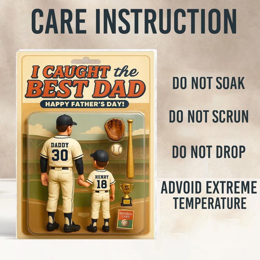 May include: A Father's Day gift set featuring two baseball figures, a baseball glove, a bat, a baseball, a trophy, and a baseball card. The text reads "I Caught the Best Dad" and "Happy Father's Day!" Care instructions are also included.