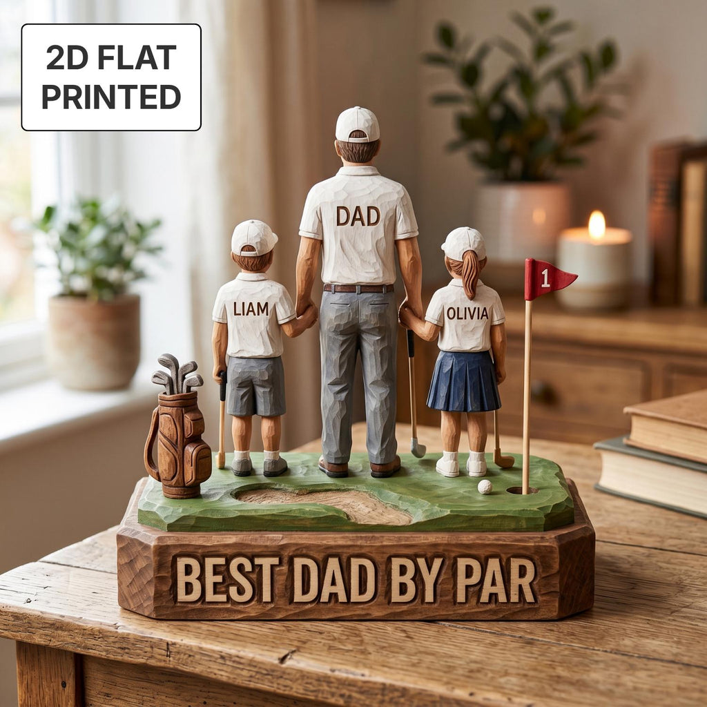 May include: A wooden golf-themed figurine featuring a father and two children, with the text "DAD", "LIAM", and "OLIVIA" on their shirts. The base reads "BEST DAD BY PAR". A golf bag and flag are also present.