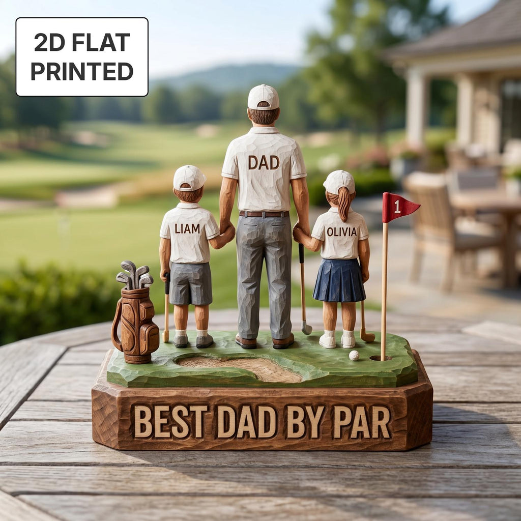 May include: A wooden golf-themed figurine featuring a father and two children, with the text "BEST DAD BY PAR". The father's shirt reads "DAD", and the children's shirts have names. A golf bag and flag are also present.