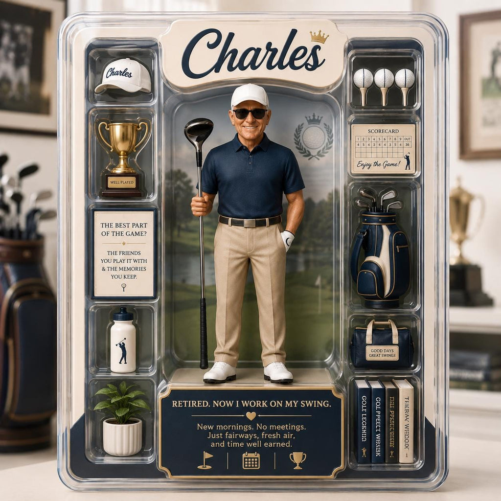 May include: A collectible action figure of a golfer named Charles in a display box. The figure wears a navy polo, khaki pants, and a white cap. Accessories include a golf club, trophy, golf bag, scorecard, water bottle, and books. Text reads: Retired. Now I work on my swing.