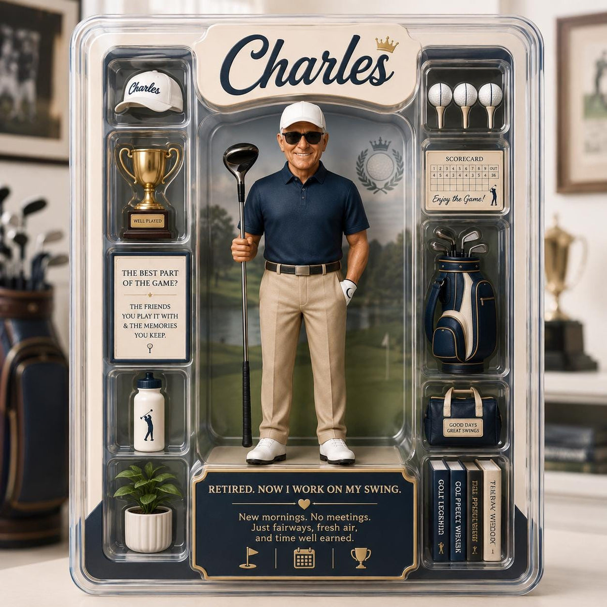 May include: A collectible action figure of a golfer named Charles in a display box. The figure wears a navy polo, khaki pants, and a white cap. Accessories include a golf club, trophy, golf bag, scorecard, water bottle, and books. Text reads: Retired. Now I work on my swing.