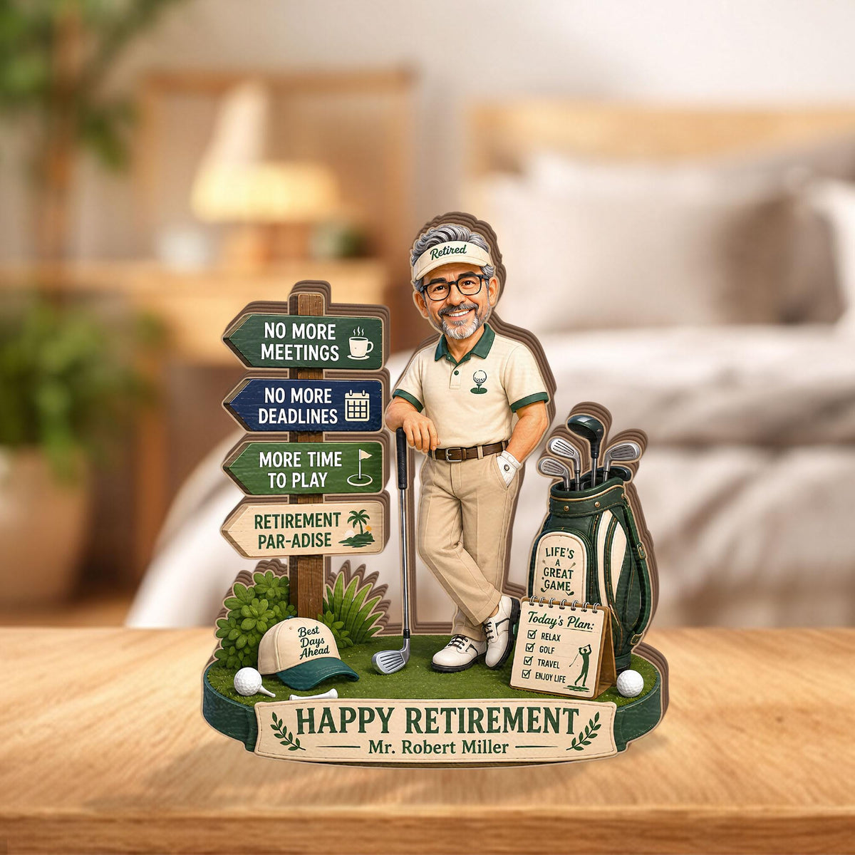 May include: A decorative retirement sign featuring a cartoon figure of a golfer leaning on a club. The sign includes directional arrows with text: NO MORE MEETINGS, NO MORE DEADLINES, MORE TIME TO PLAY, RETIREMENT PAR-ADISE, and HAPPY RETIREMENT Mr. Robert Miller.