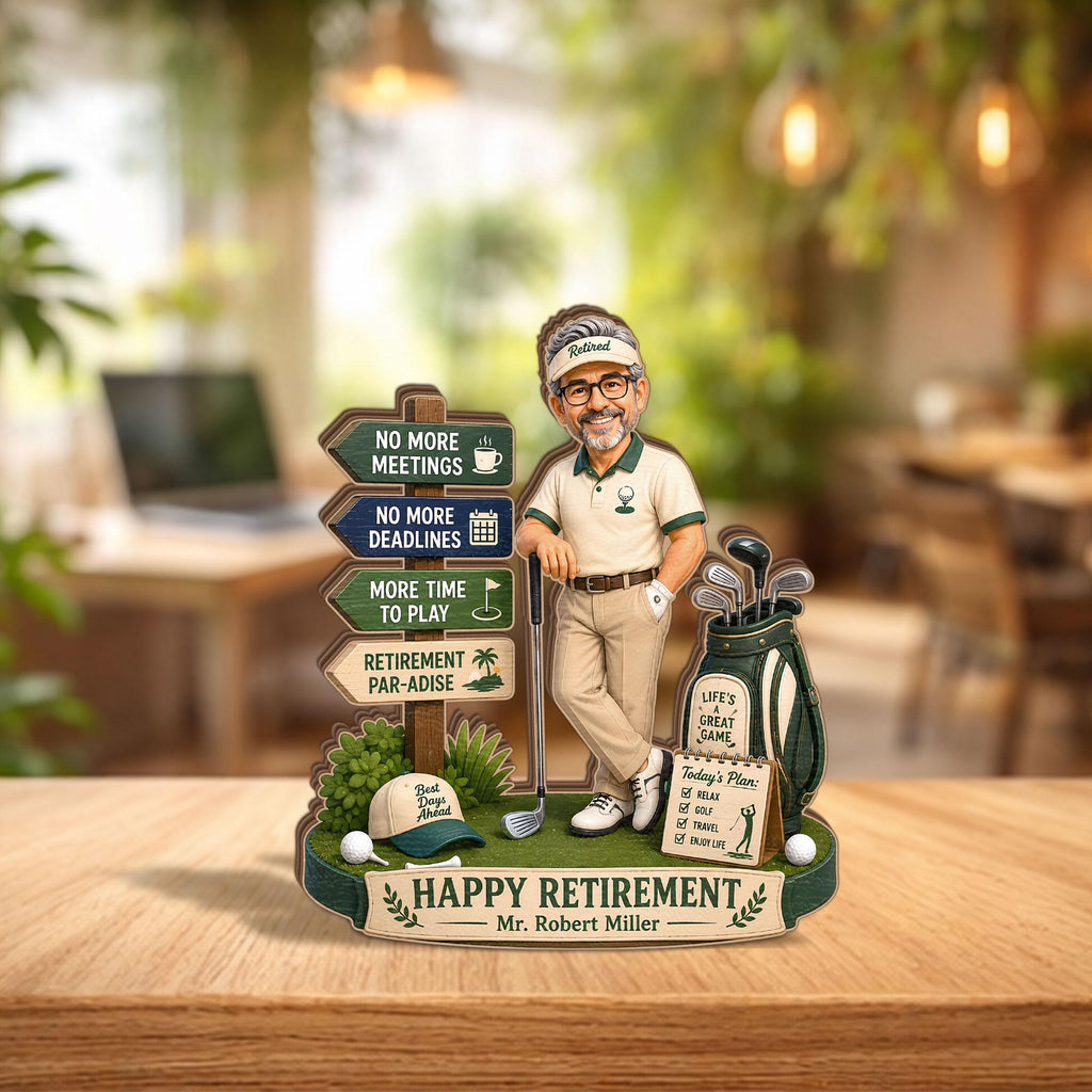 May include: A decorative retirement sign featuring a cartoon golfer leaning on a club next to a golf bag. The sign includes directional arrows with text: No More Meetings, No More Deadlines, More Time To Play, Retirement Par-Adise, and Happy Retirement Mr. Robert Miller.