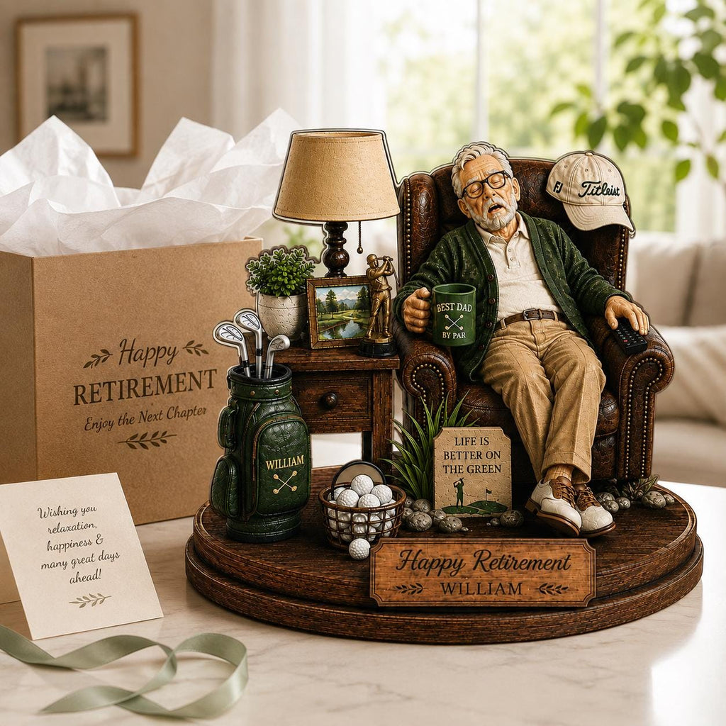 May include: A retirement-themed figurine set featuring an older person sleeping in a brown leather armchair, a golf bag with clubs, a lamp, a small table, a basket of golf balls, and a sign reading Happy Retirement WILLIAM and BEST DAD BY PAR.