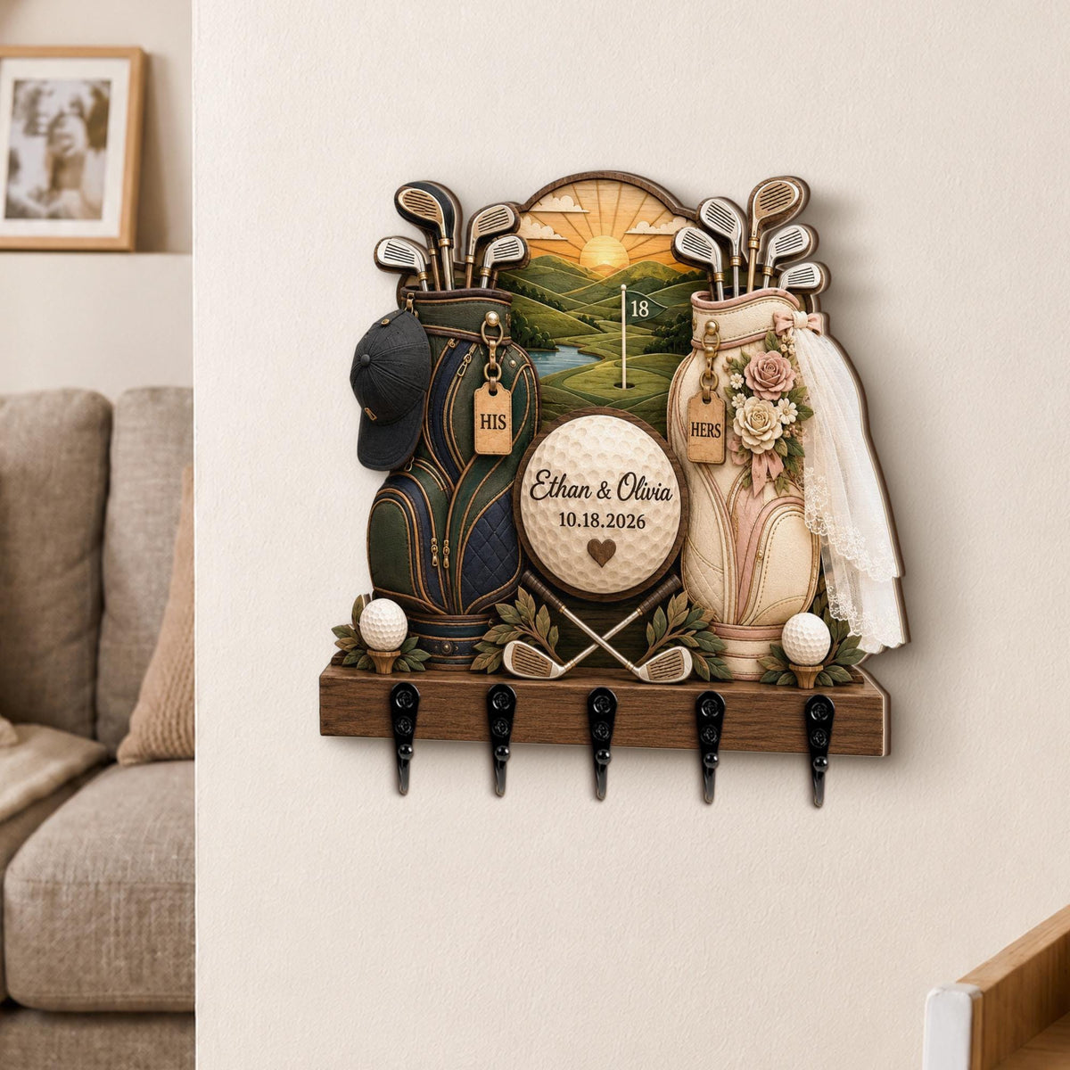 May include: A wall-mounted wooden key holder featuring two golf bags, one dark green and one cream with a veil, flanking a central golf ball with the text Ethan & Olivia 10.18.2026. The design includes golf clubs, a landscape scene, and five black hooks.