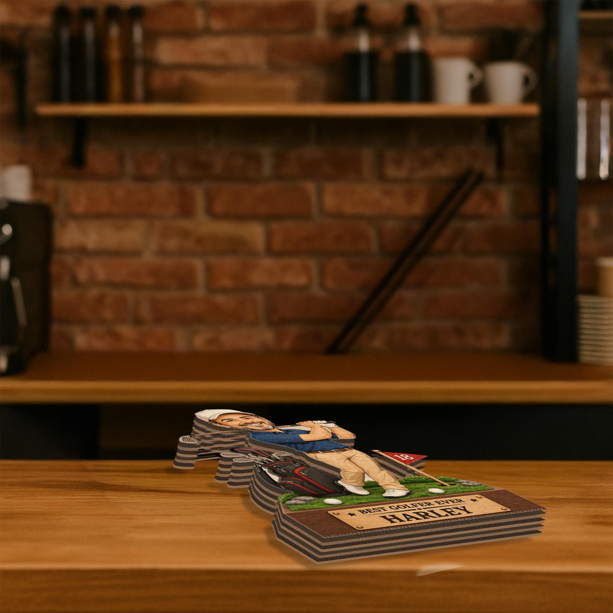 May include: A multi-layered wooden cutout display featuring a cartoon golfer in a blue shirt and tan pants on a green putting surface. The base includes a plaque with the text BEST GOLFER EVER and the name HARLEY printed in black lettering.