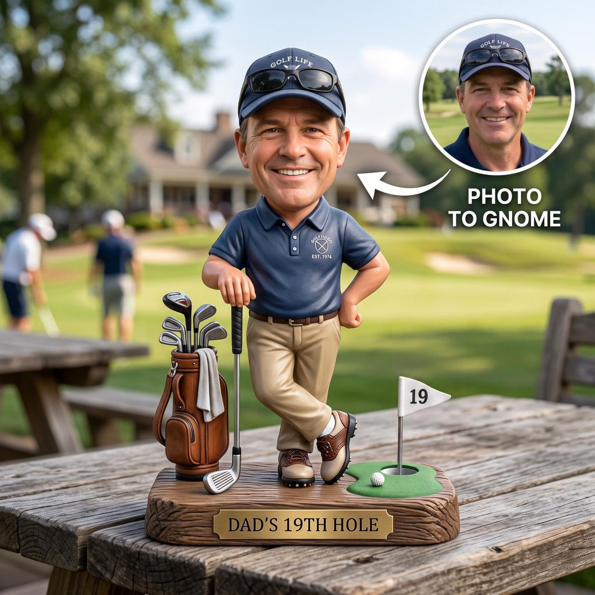 May include: A custom bobblehead figurine of a golfer wearing a navy blue polo shirt, khaki pants, and a navy cap with sunglasses. The figure stands on a base labeled DAD'S 19TH HOLE, featuring a golf bag with clubs, a golf ball, and a flag marked 19.