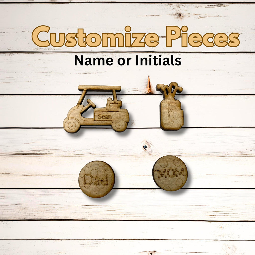 May include: Wooden golf-themed pieces with the text "Customize Pieces Name or Initials". The image shows a golf cart, golf bag, and two golf ball markers with the words "Dad" and "Mom".